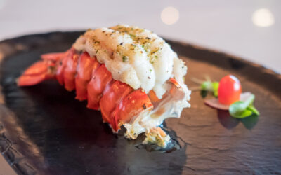 Indulge in Caribbean Luxury: The Grilled Lobster Tail at Renzo’s Steakhouse